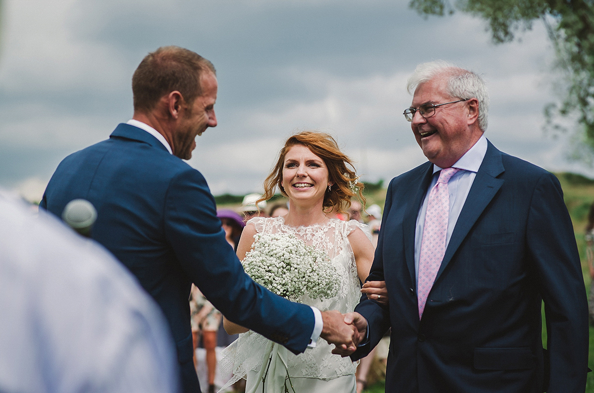 Posie wore a Delphine Manivet gown for her rustic, handmade, outdoor handfasting ceremony, captured by Amy Taylor Imaging.