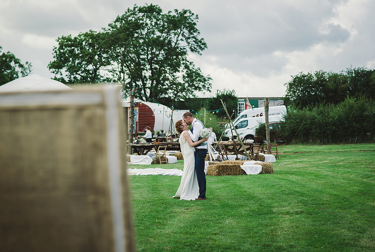 Posie wore a Delphine Manivet gown for her rustic, handmade, outdoor handfasting ceremony, captured by Amy Taylor Imaging.