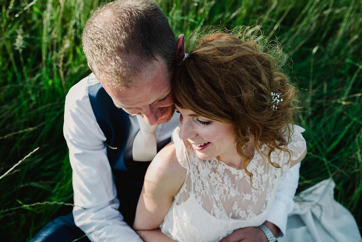 Posie wore a Delphine Manivet gown for her rustic, handmade, outdoor handfasting ceremony, captured by Amy Taylor Imaging.