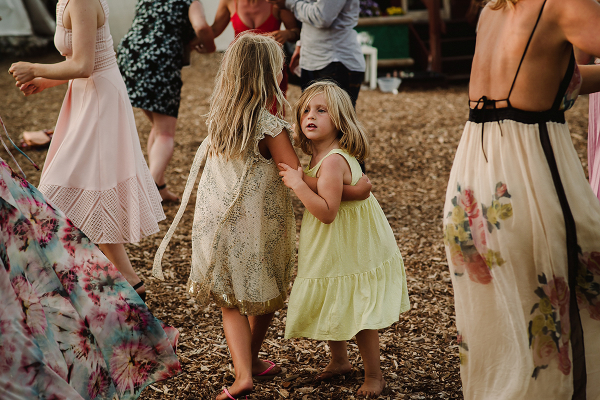 Posie wore a Delphine Manivet gown for her rustic, handmade, outdoor handfasting ceremony, captured by Amy Taylor Imaging.