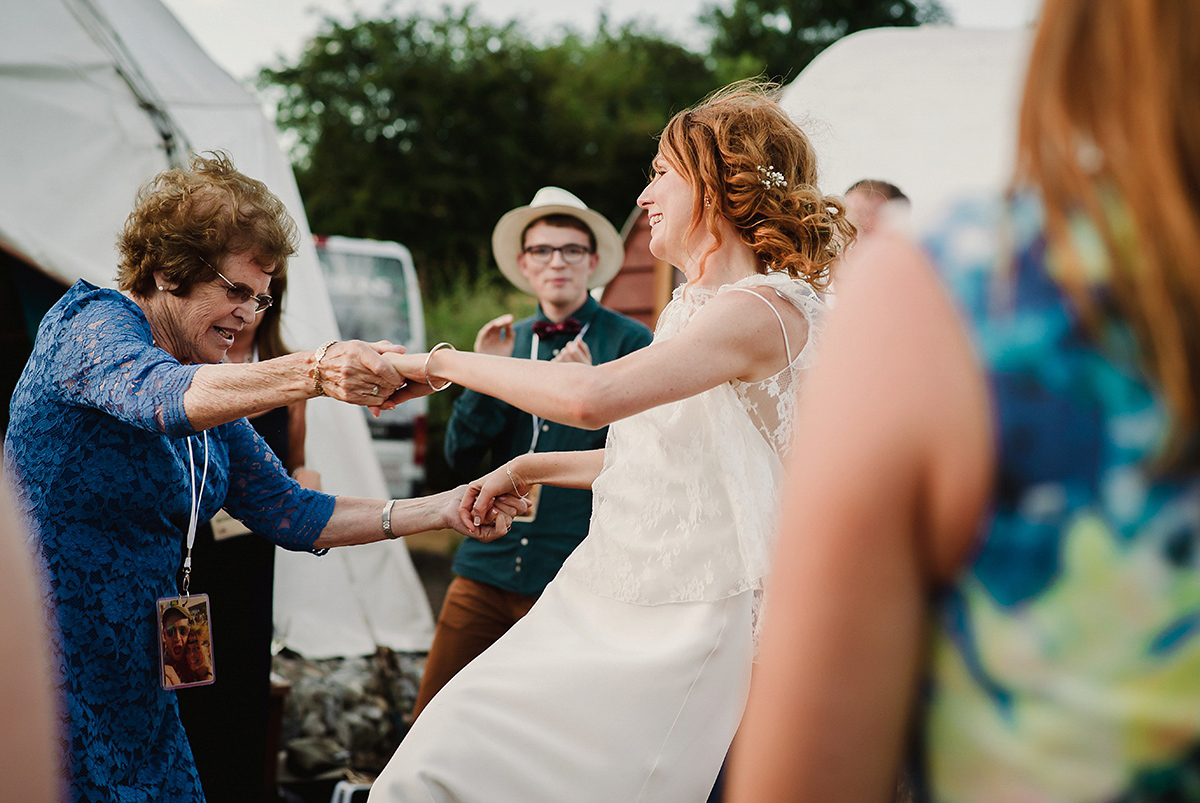 Posie wore a Delphine Manivet gown for her rustic, handmade, outdoor handfasting ceremony, captured by Amy Taylor Imaging.