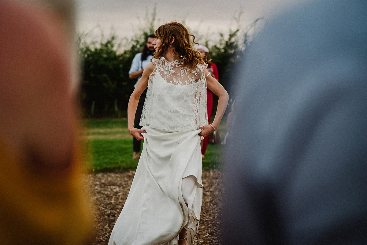 Posie wore a Delphine Manivet gown for her rustic, handmade, outdoor handfasting ceremony, captured by Amy Taylor Imaging.