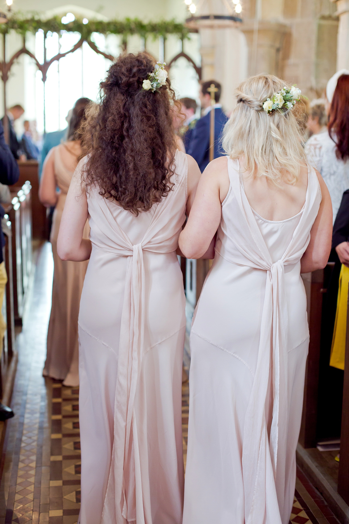 Connie wore a black leather jacket and dress by Belle & Bunty for her English wildfllower meadow inspired wedding. Photography by Emma Sekhonn.