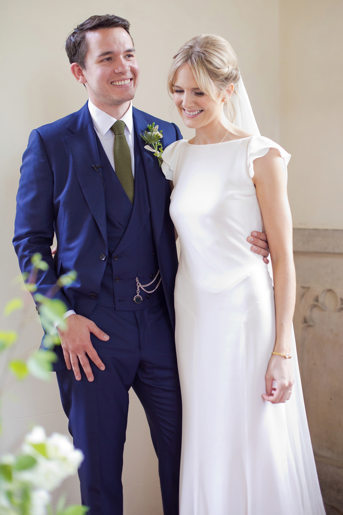 Connie wore a black leather jacket and dress by Belle & Bunty for her English wildfllower meadow inspired wedding. Photography by Emma Sekhonn.