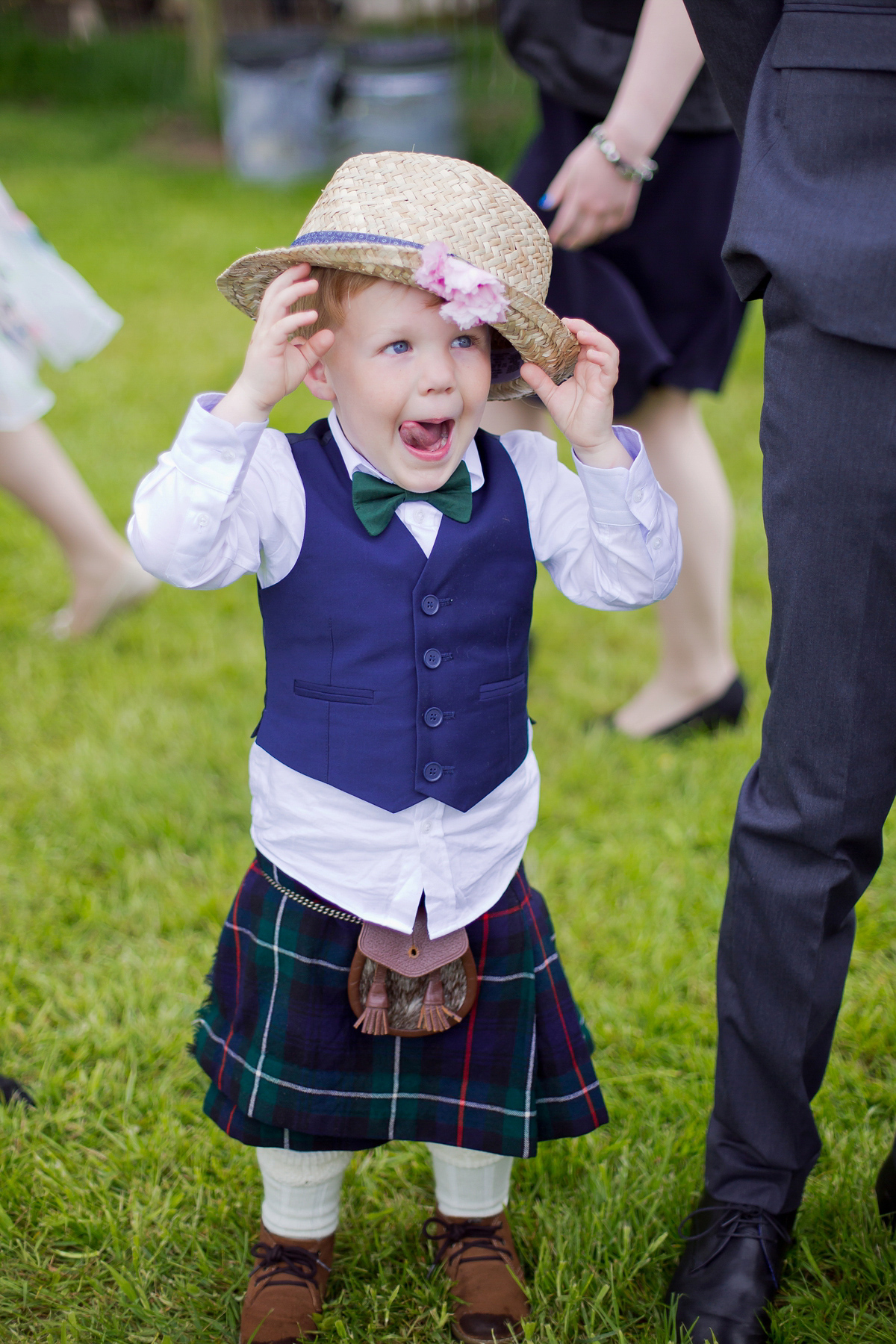 Connie wore a black leather jacket and dress by Belle & Bunty for her English wildfllower meadow inspired wedding. Photography by Emma Sekhonn.