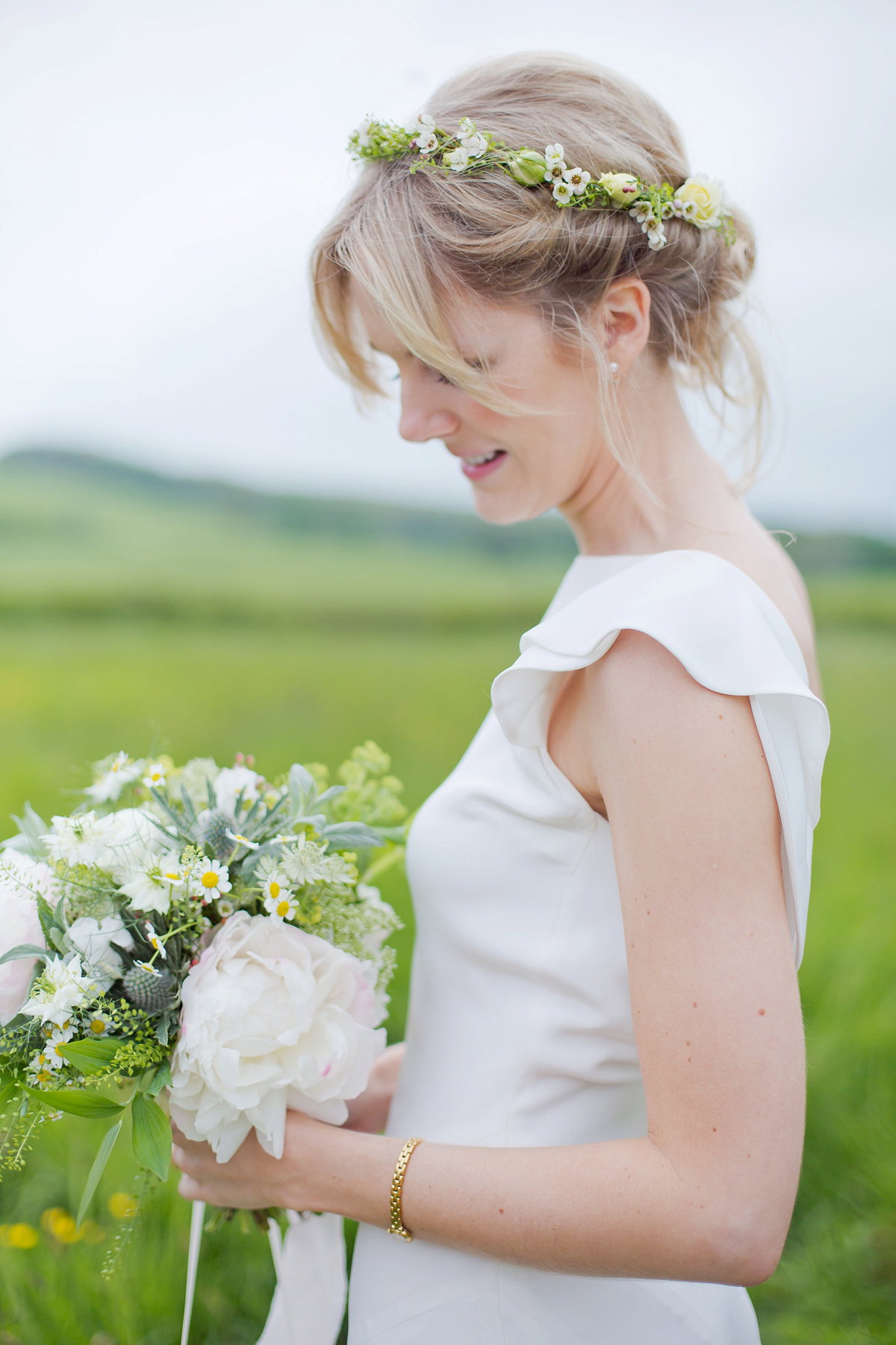 Connie wore a black leather jacket and dress by Belle & Bunty for her English wildfllower meadow inspired wedding. Photography by Emma Sekhonn.