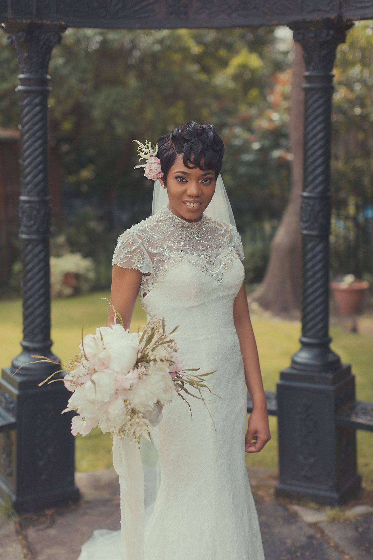 Chioma wore a David's Bridal gown for her Christian and 1920's vintage glamrous inspired wedding. Photography by James Green.