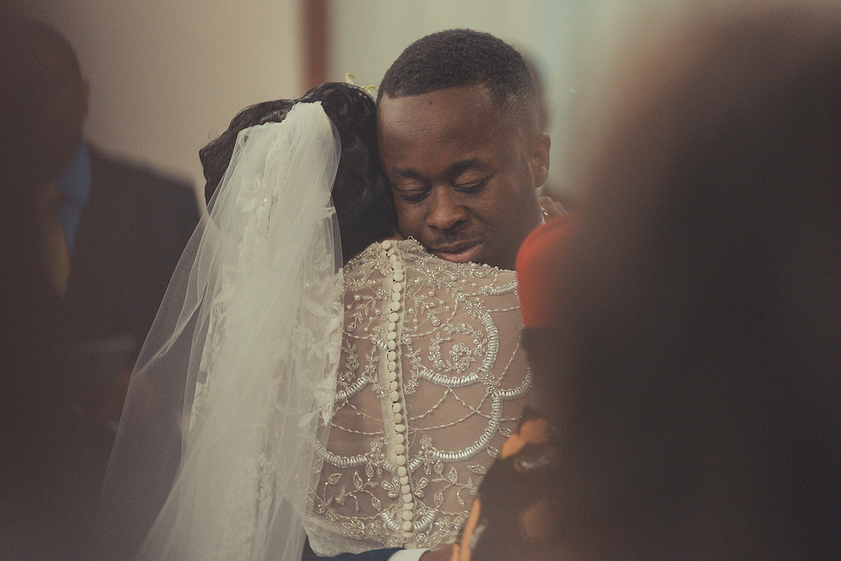 Chioma wore a David's Bridal gown for her Christian and 1920's vintage glamrous inspired wedding. Photography by James Green.