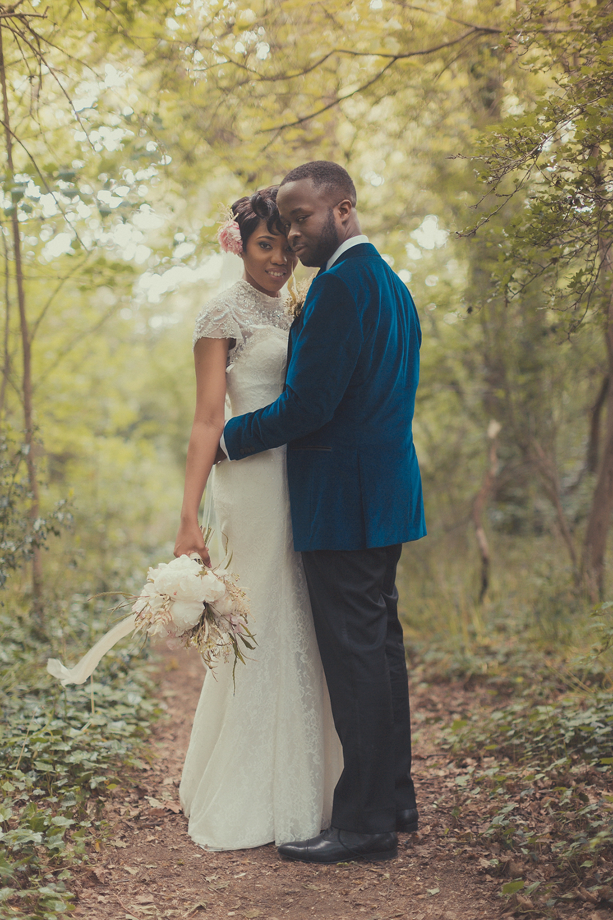 Chioma wore a David's Bridal gown for her Christian and 1920's vintage glamrous inspired wedding. Photography by James Green.