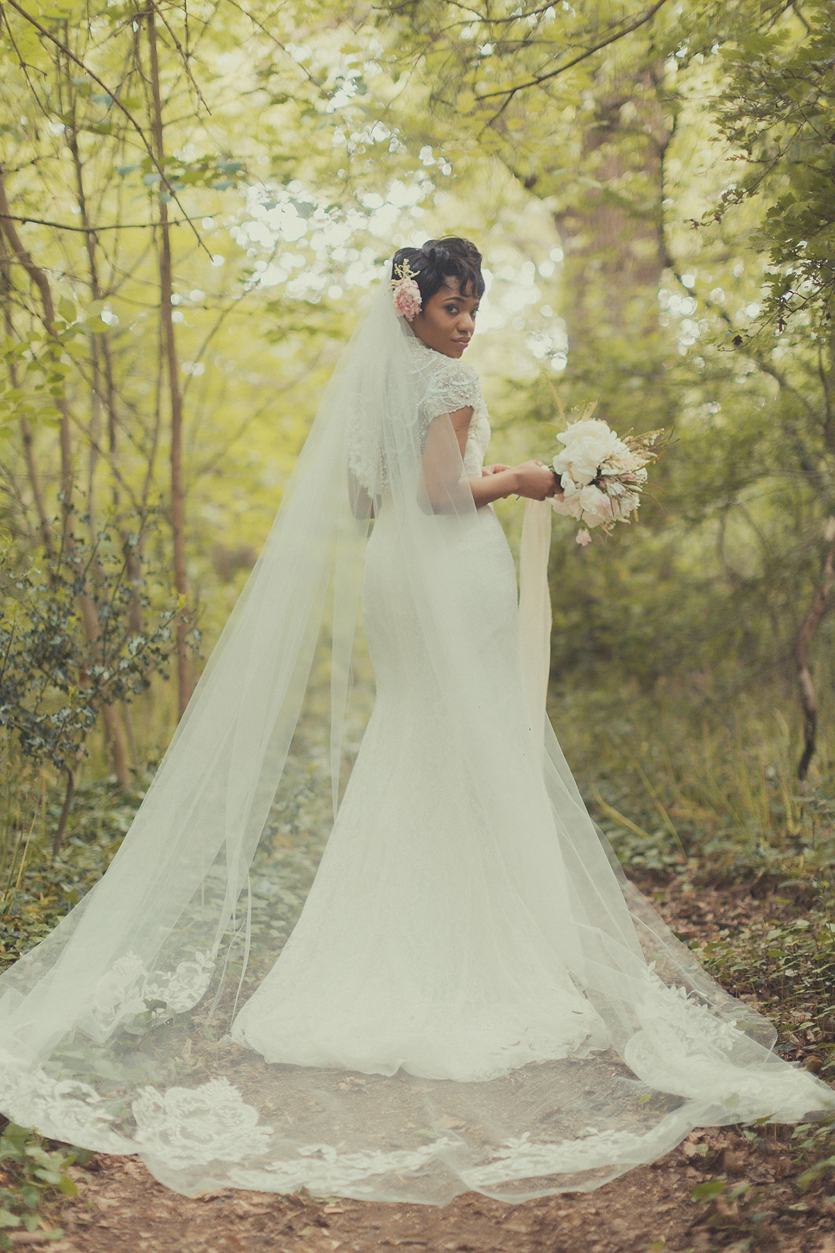 Chioma wore a David's Bridal gown for her Christian and 1920's vintage glamrous inspired wedding. Photography by James Green.