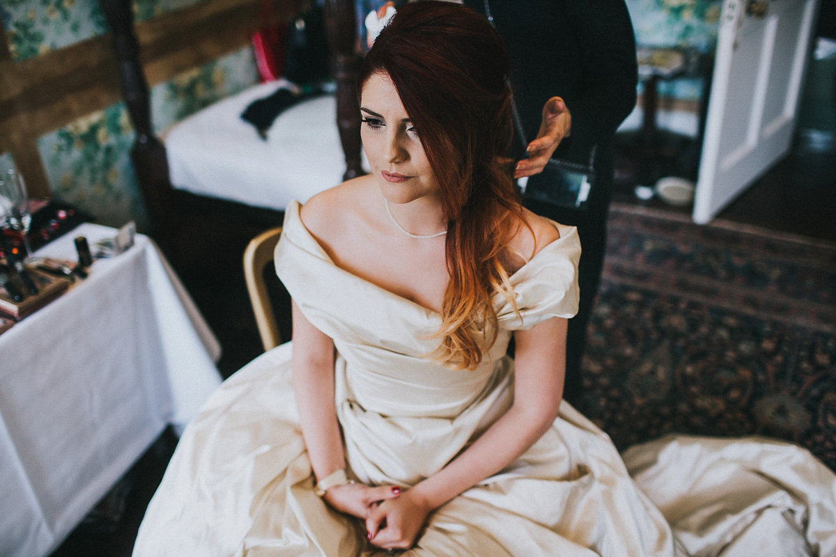 Bride Natasha wore a gown inspired by the dress worn by Dita von Teese for her wedding to Marilyn Manson. Natasha and Ian's wedding was full of Autumnal, gothic romance. Photography by Matt Horan.