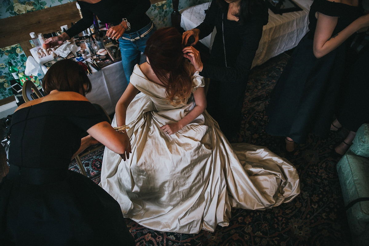 Bride Natasha wore a gown inspired by the dress worn by Dita von Teese for her wedding to Marilyn Manson. Natasha and Ian's wedding was full of Autumnal, gothic romance. Photography by Matt Horan.