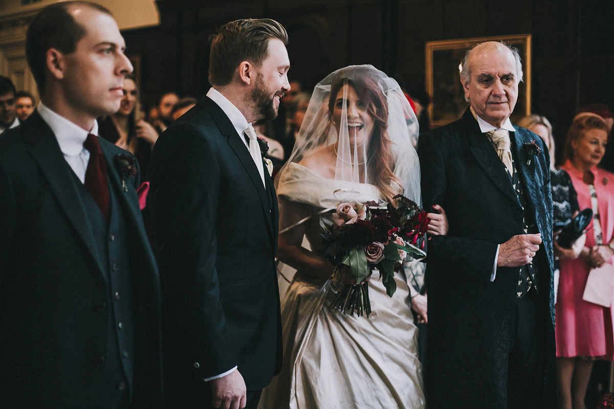 Bride Natasha wore a gown inspired by the dress worn by Dita von Teese for her wedding to Marilyn Manson. Natasha and Ian's wedding was full of Autumnal, gothic romance. Photography by Matt Horan.