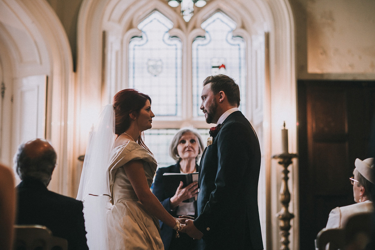 Bride Natasha wore a gown inspired by the dress worn by Dita von Teese for her wedding to Marilyn Manson. Natasha and Ian's wedding was full of Autumnal, gothic romance. Photography by Matt Horan.