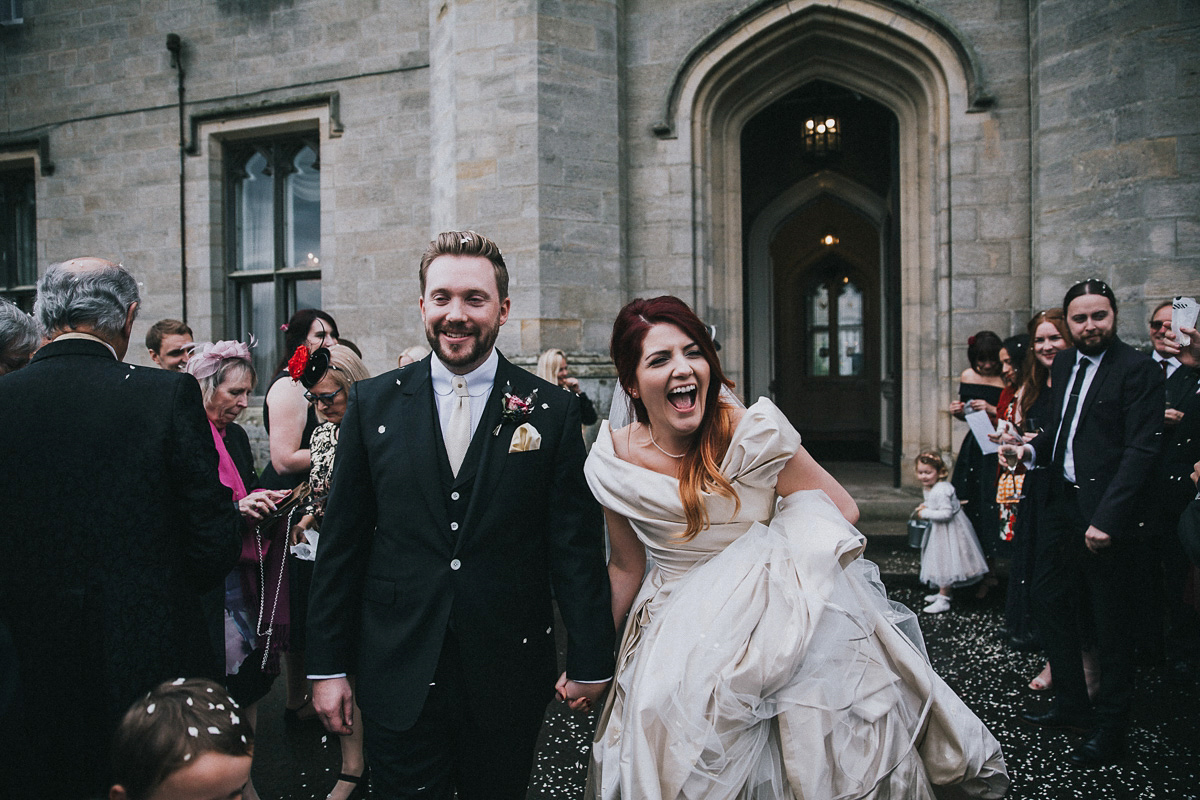 Bride Natasha wore a gown inspired by the dress worn by Dita von Teese for her wedding to Marilyn Manson. Natasha and Ian's wedding was full of Autumnal, gothic romance. Photography by Matt Horan.