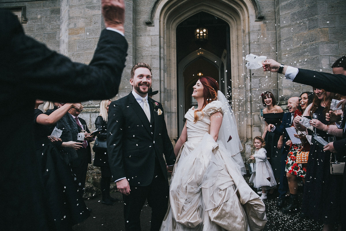 Bride Natasha wore a gown inspired by the dress worn by Dita von Teese for her wedding to Marilyn Manson. Natasha and Ian's wedding was full of Autumnal, gothic romance. Photography by Matt Horan.