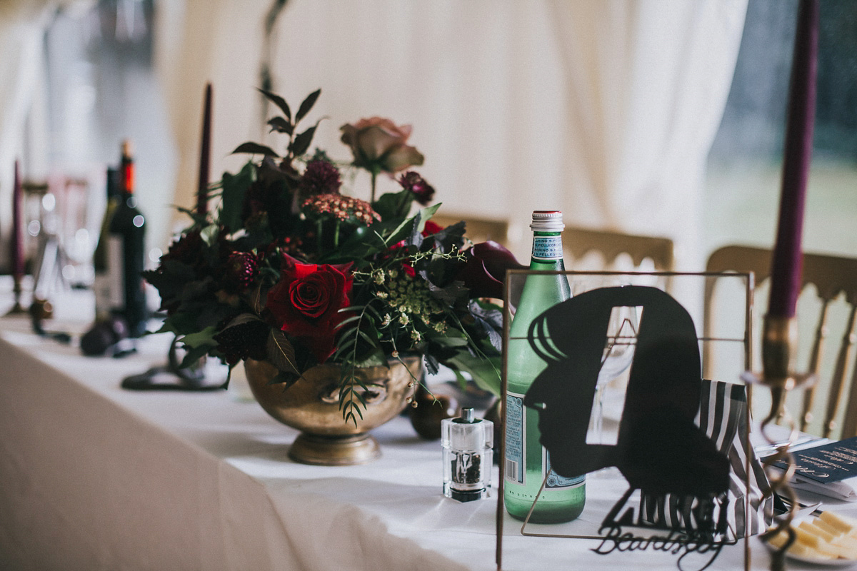 Bride Natasha wore a gown inspired by the dress worn by Dita von Teese for her wedding to Marilyn Manson. Natasha and Ian's wedding was full of Autumnal, gothic romance. Photography by Matt Horan.