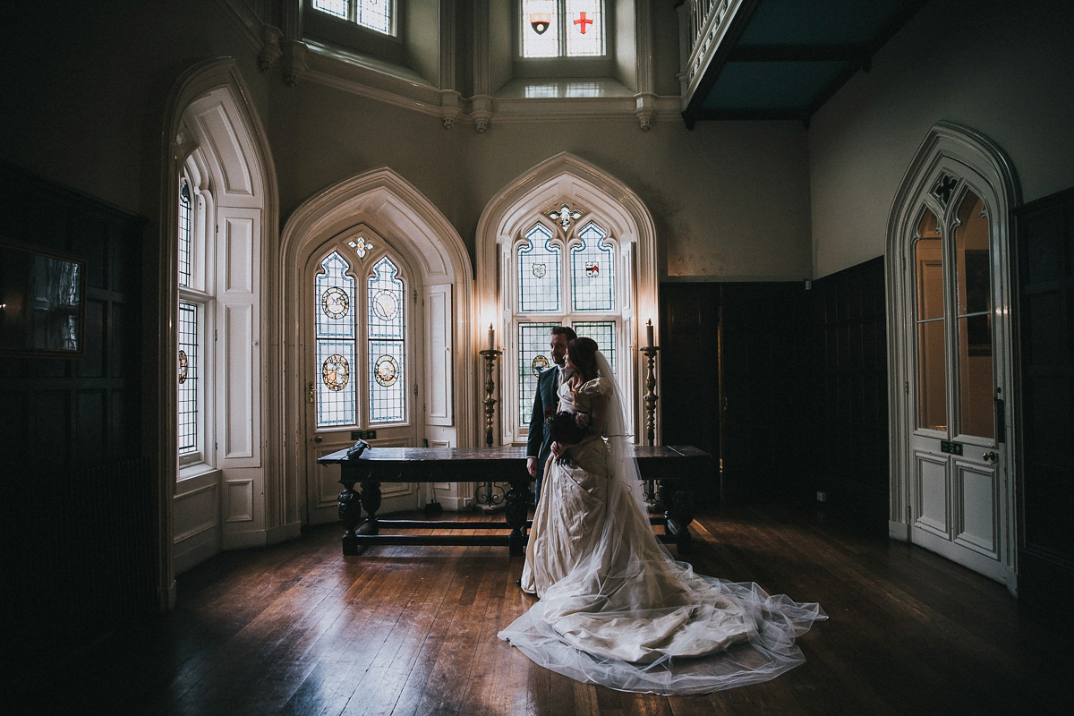 Bride Natasha wore a gown inspired by the dress worn by Dita von Teese for her wedding to Marilyn Manson. Natasha and Ian's wedding was full of Autumnal, gothic romance. Photography by Matt Horan.