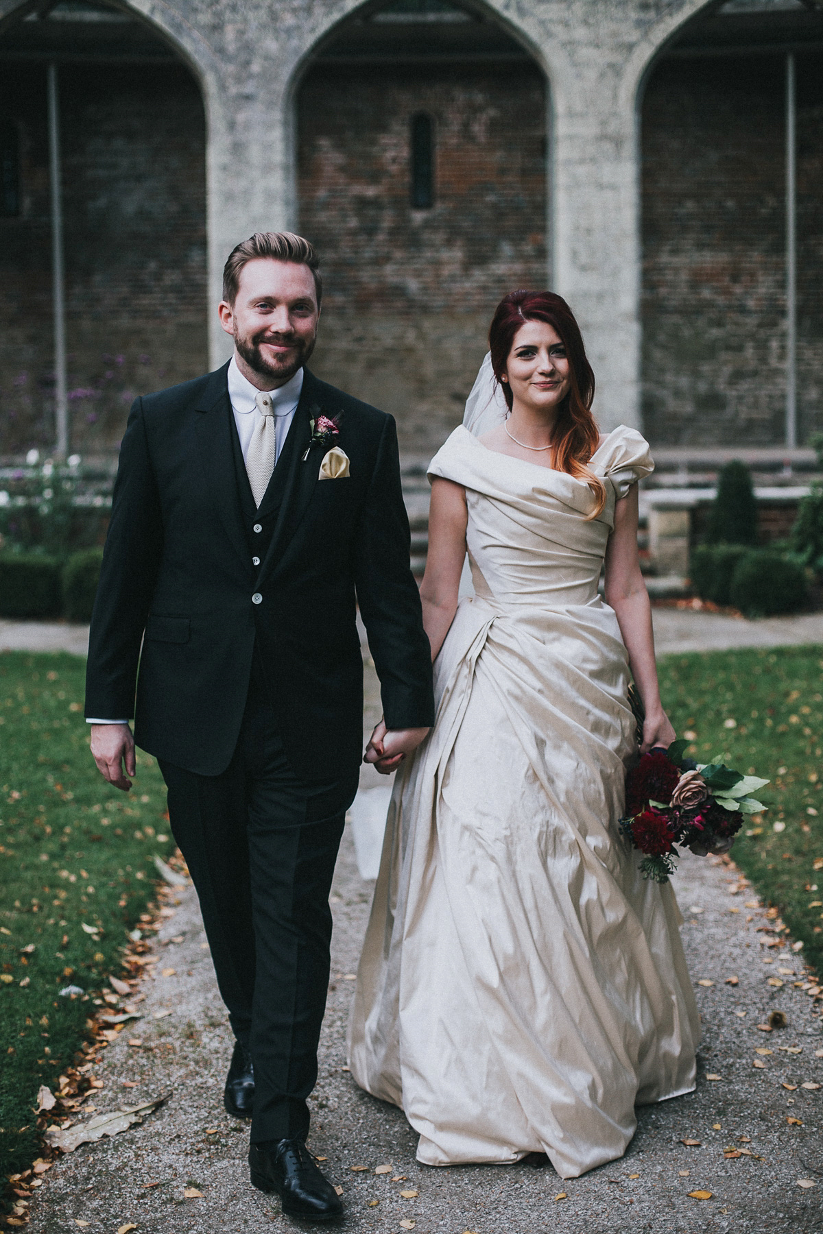 Bride Natasha wore a gown inspired by the dress worn by Dita von Teese for her wedding to Marilyn Manson. Natasha and Ian's wedding was full of Autumnal, gothic romance. Photography by Matt Horan.
