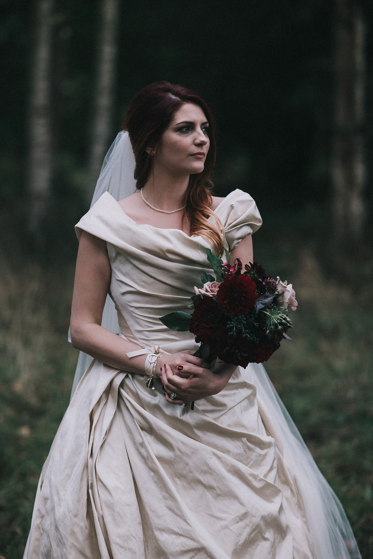 Bride Natasha wore a gown inspired by the dress worn by Dita von Teese for her wedding to Marilyn Manson. Natasha and Ian's wedding was full of Autumnal, gothic romance. Photography by Matt Horan.