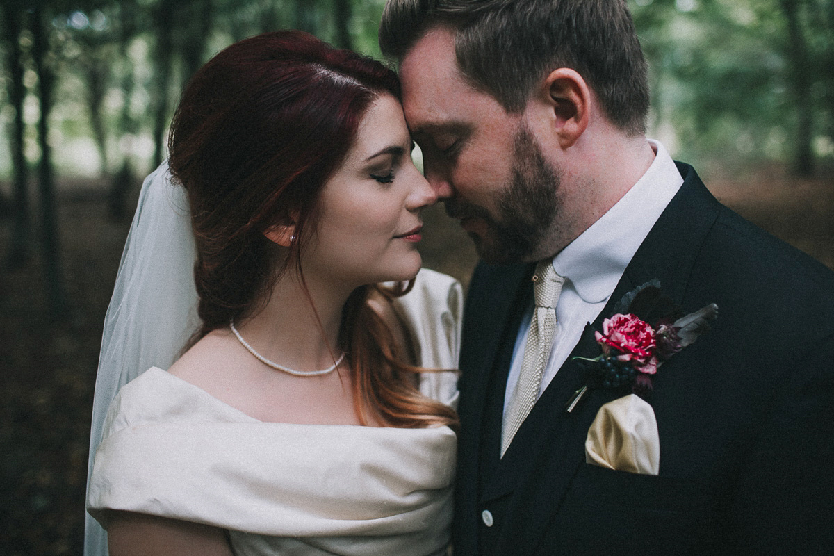 Bride Natasha wore a gown inspired by the dress worn by Dita von Teese for her wedding to Marilyn Manson. Natasha and Ian's wedding was full of Autumnal, gothic romance. Photography by Matt Horan.