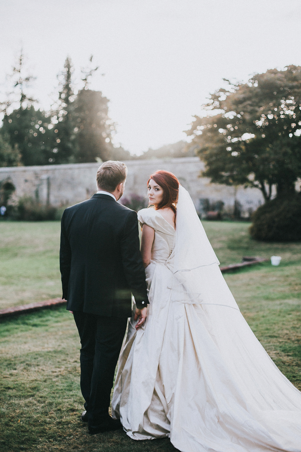 Bride Natasha wore a gown inspired by the dress worn by Dita von Teese for her wedding to Marilyn Manson. Natasha and Ian's wedding was full of Autumnal, gothic romance. Photography by Matt Horan.