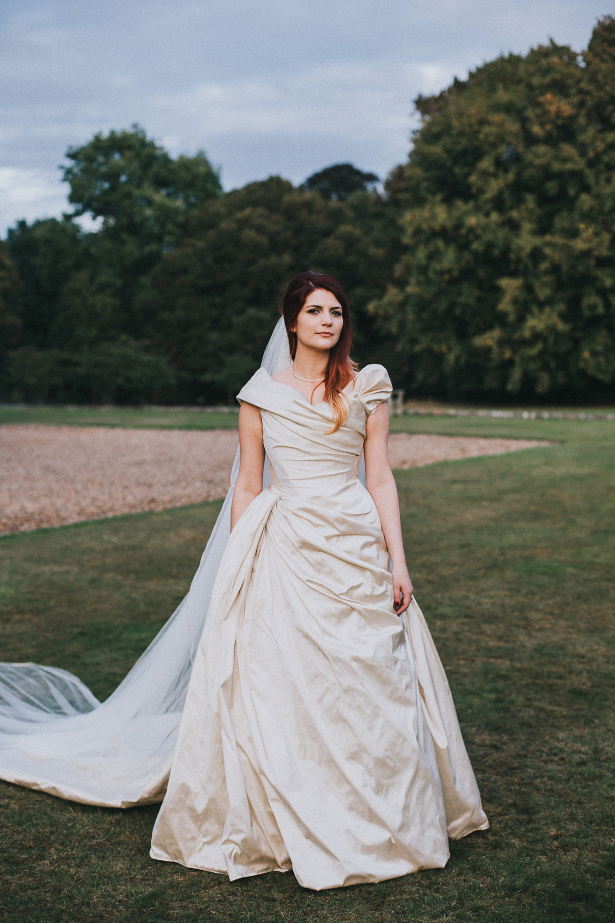 Bride Natasha wore a gown inspired by the dress worn by Dita von Teese for her wedding to Marilyn Manson. Natasha and Ian's wedding was full of Autumnal, gothic romance. Photography by Matt Horan.