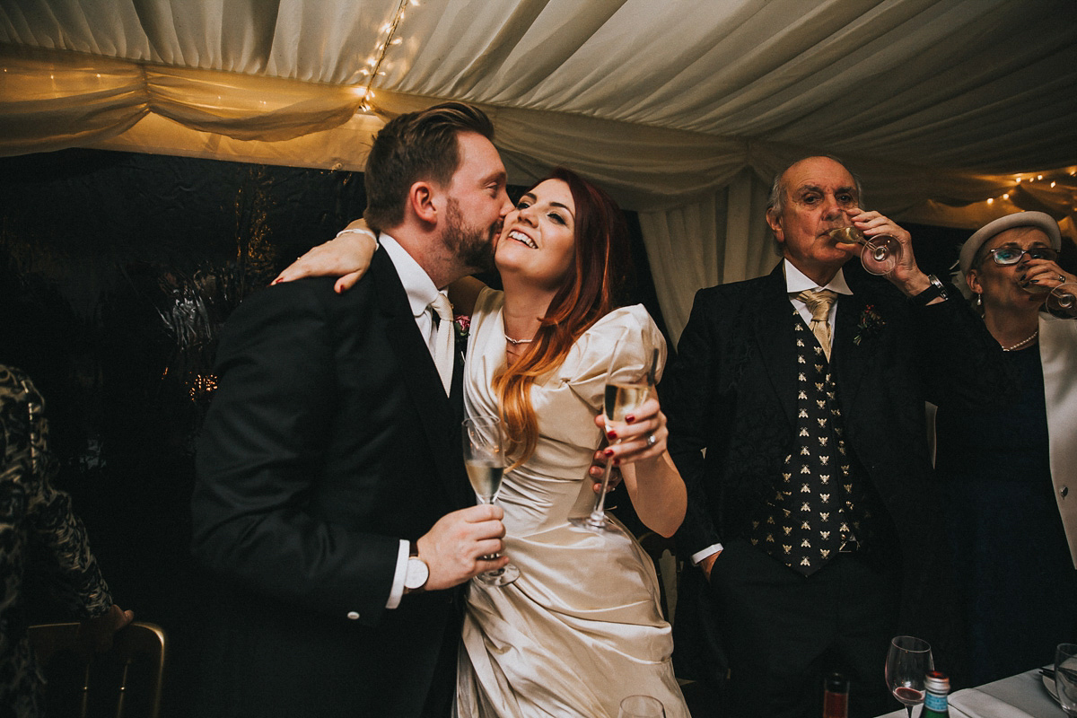 Bride Natasha wore a gown inspired by the dress worn by Dita von Teese for her wedding to Marilyn Manson. Natasha and Ian's wedding was full of Autumnal, gothic romance. Photography by Matt Horan.