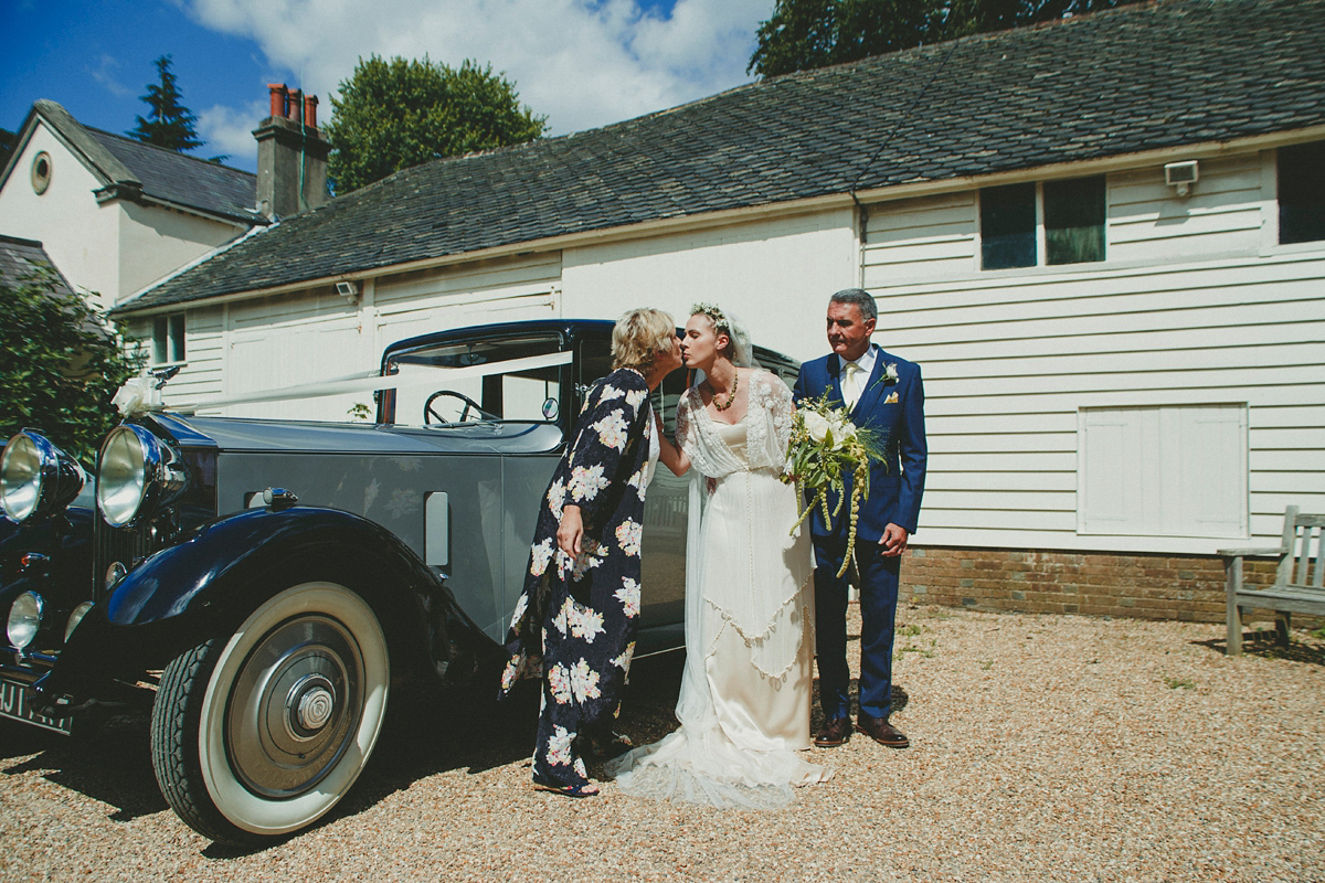 Katie wore a Catherne Deane gown from Leonie Claire bridal boutique in Hove, for her lovely summer garden wedding. Photography by Manon Pauffin.