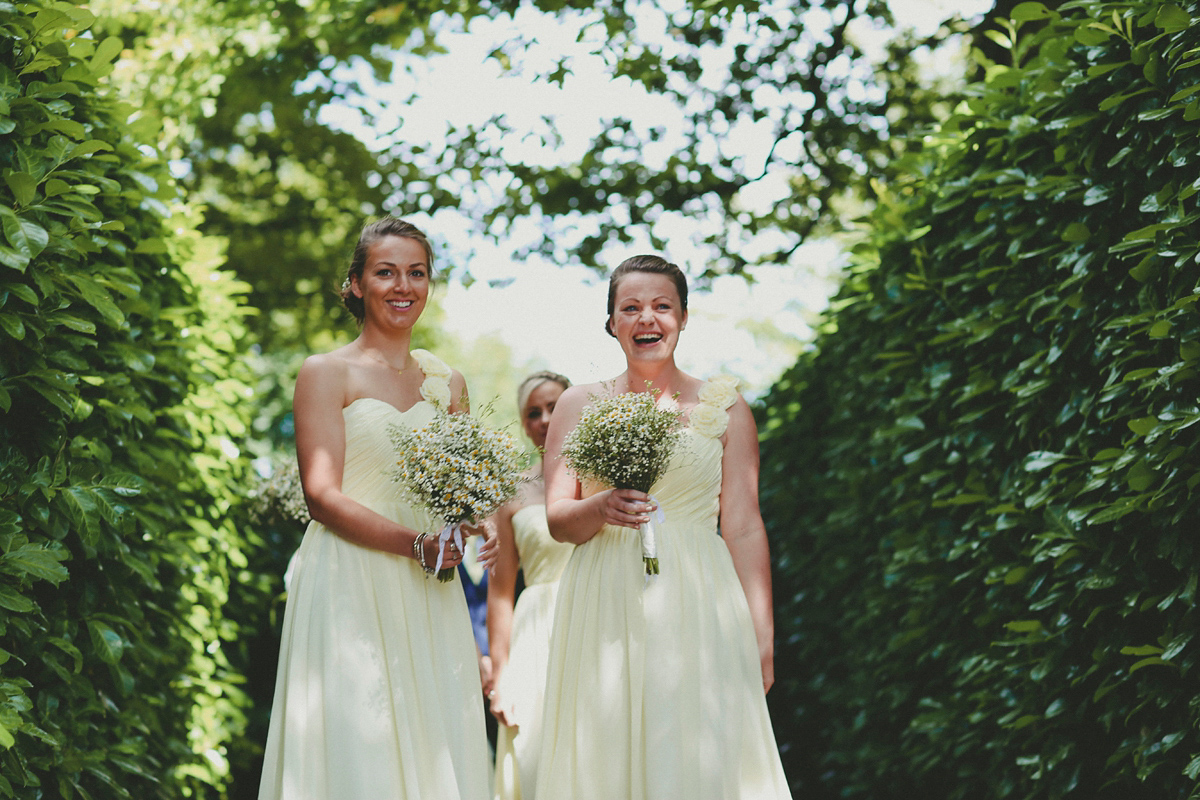 Katie wore a Catherne Deane gown from Leonie Claire bridal boutique in Hove, for her lovely summer garden wedding. Photography by Manon Pauffin.