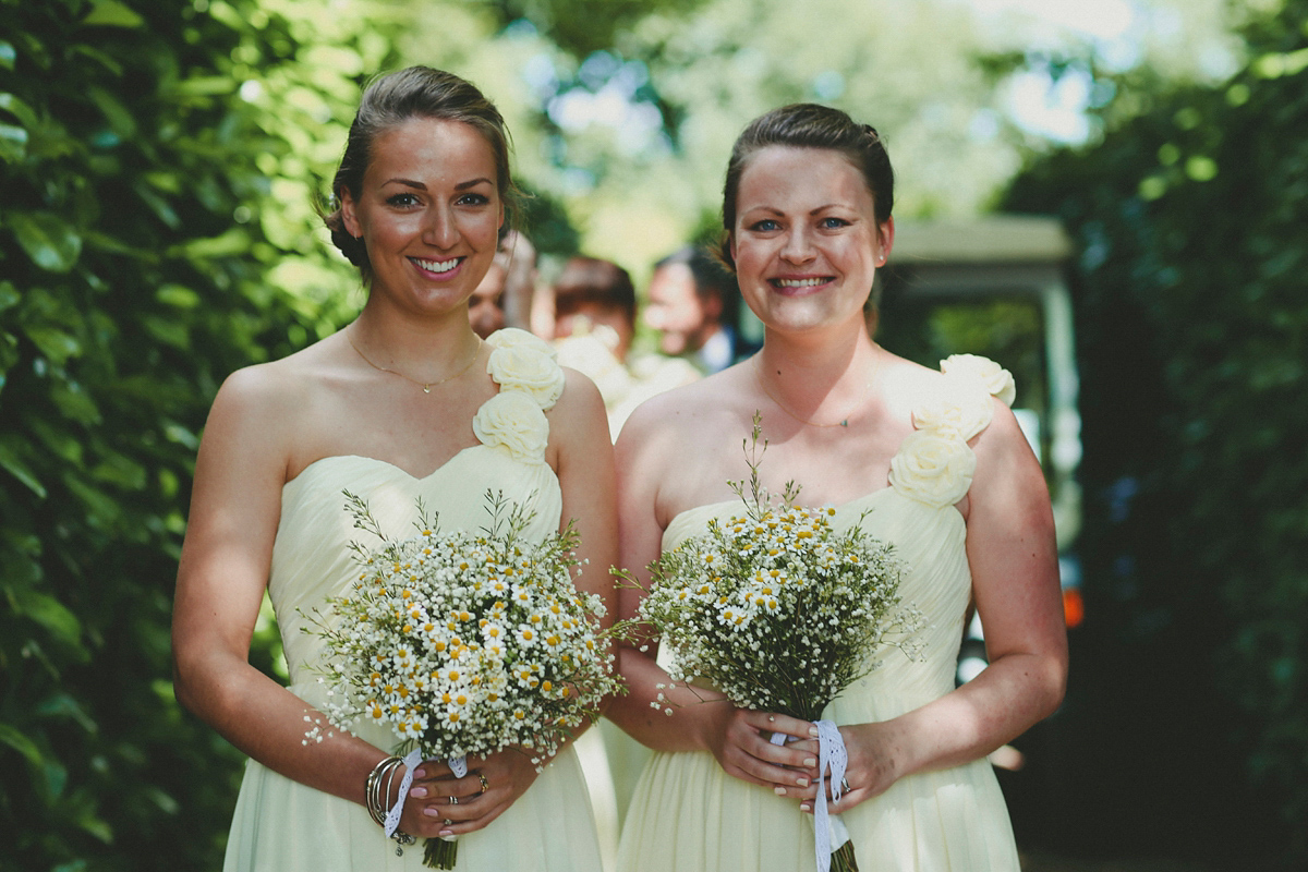 Katie wore a Catherne Deane gown from Leonie Claire bridal boutique in Hove, for her lovely summer garden wedding. Photography by Manon Pauffin.