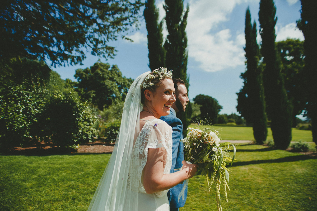 Katie wore a Catherne Deane gown from Leonie Claire bridal boutique in Hove, for her lovely summer garden wedding. Photography by Manon Pauffin.