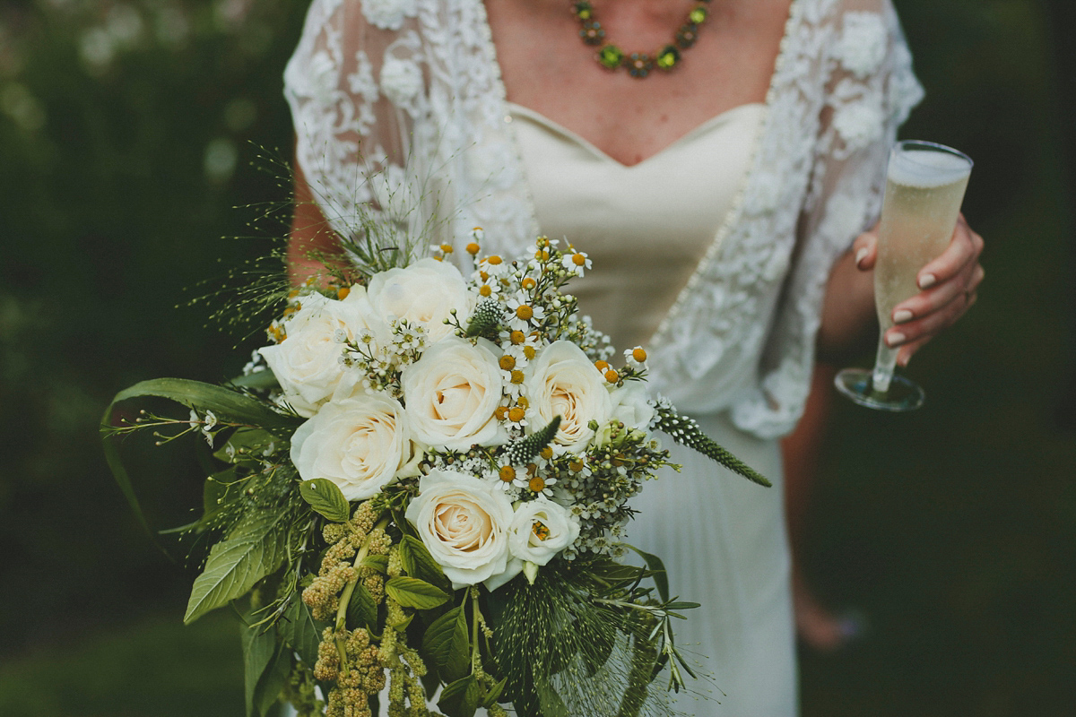 Katie wore a Catherne Deane gown from Leonie Claire bridal boutique in Hove, for her lovely summer garden wedding. Photography by Manon Pauffin.