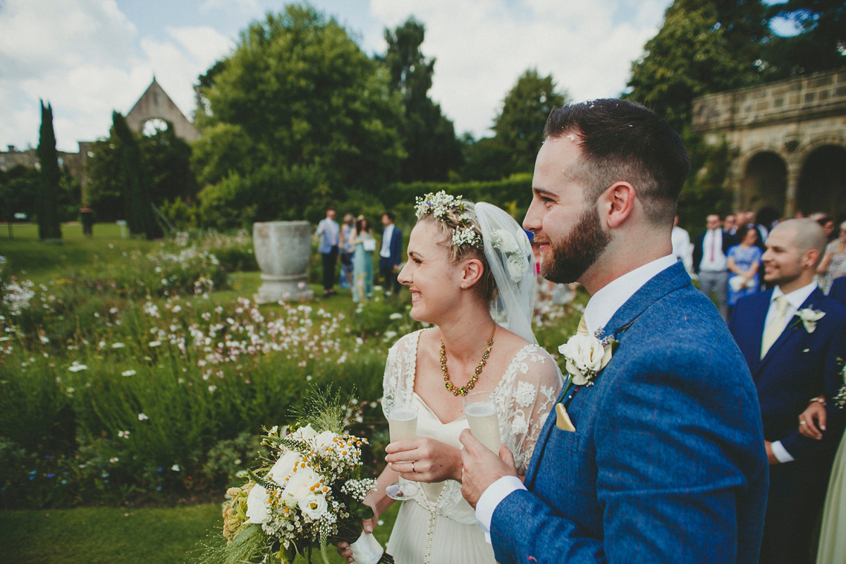 Katie wore a Catherne Deane gown from Leonie Claire bridal boutique in Hove, for her lovely summer garden wedding. Photography by Manon Pauffin.