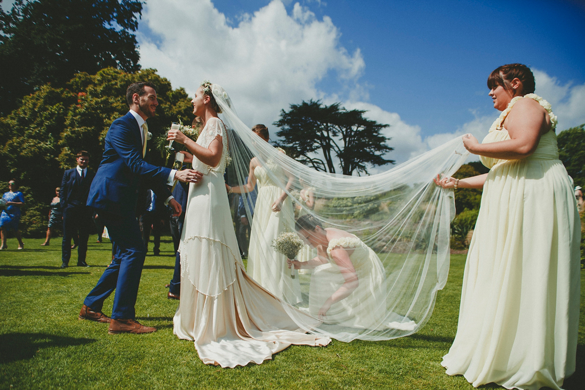 Katie wore a Catherne Deane gown from Leonie Claire bridal boutique in Hove, for her lovely summer garden wedding. Photography by Manon Pauffin.