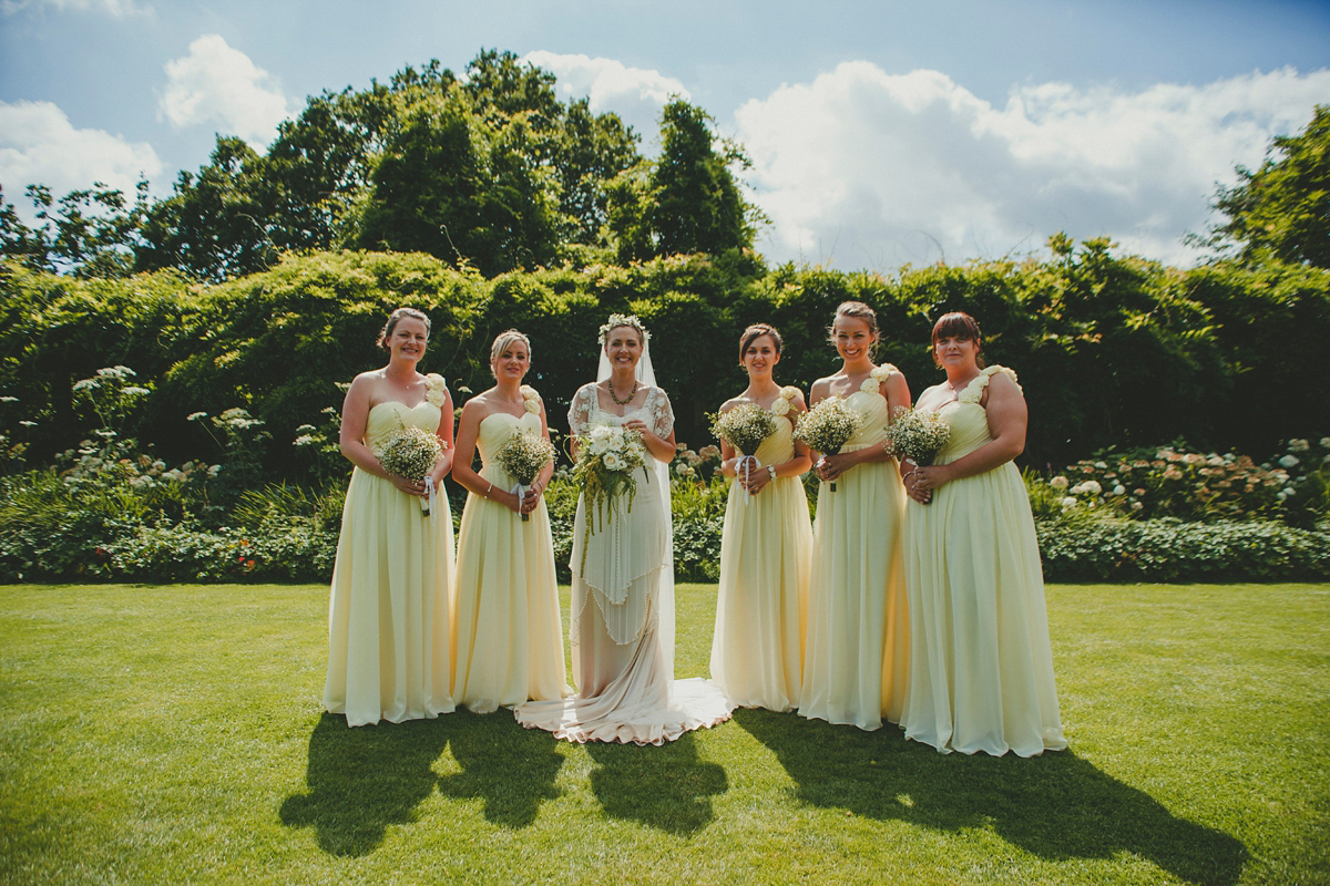Katie wore a Catherne Deane gown from Leonie Claire bridal boutique in Hove, for her lovely summer garden wedding. Photography by Manon Pauffin.
