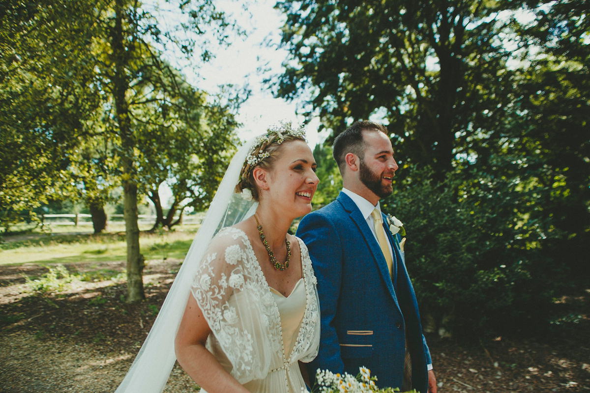 Katie wore a Catherne Deane gown from Leonie Claire bridal boutique in Hove, for her lovely summer garden wedding. Photography by Manon Pauffin.