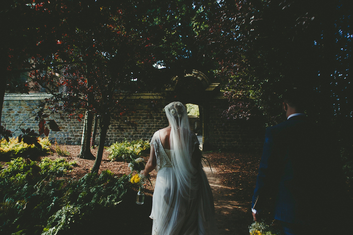 Katie wore a Catherne Deane gown from Leonie Claire bridal boutique in Hove, for her lovely summer garden wedding. Photography by Manon Pauffin.