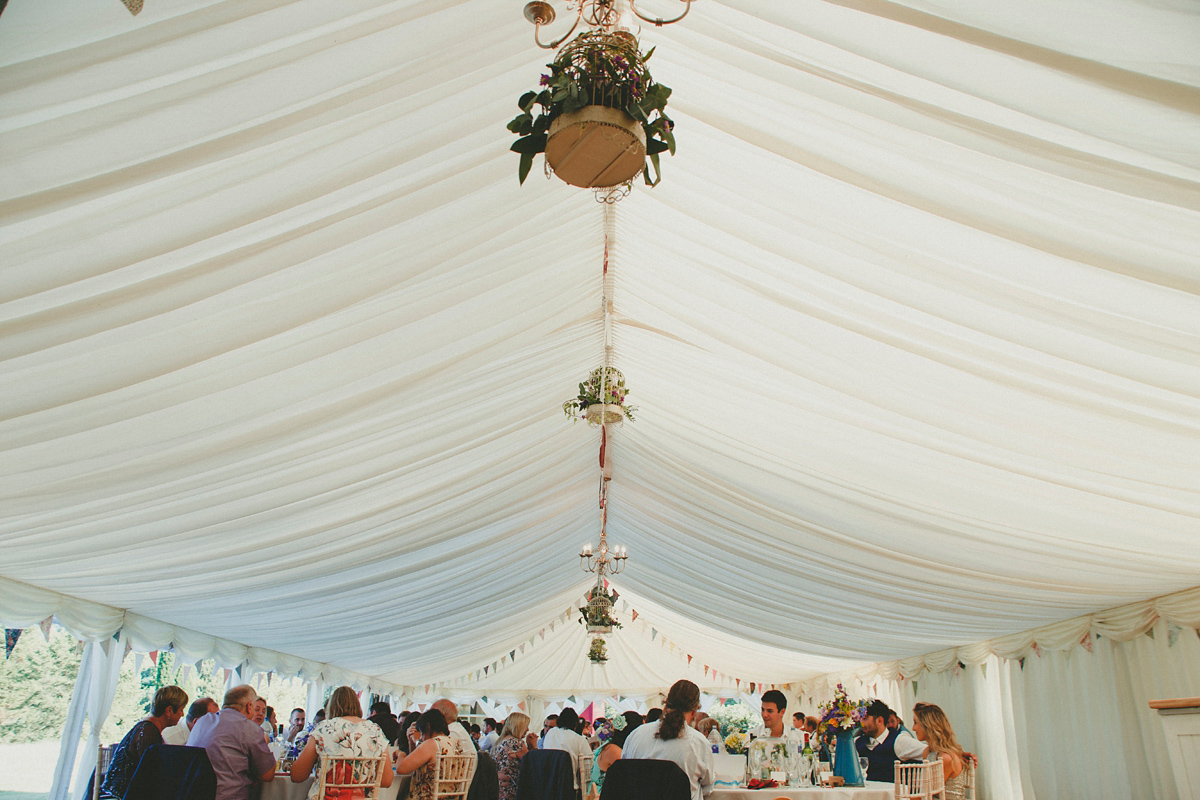 Katie wore a Catherne Deane gown from Leonie Claire bridal boutique in Hove, for her lovely summer garden wedding. Photography by Manon Pauffin.