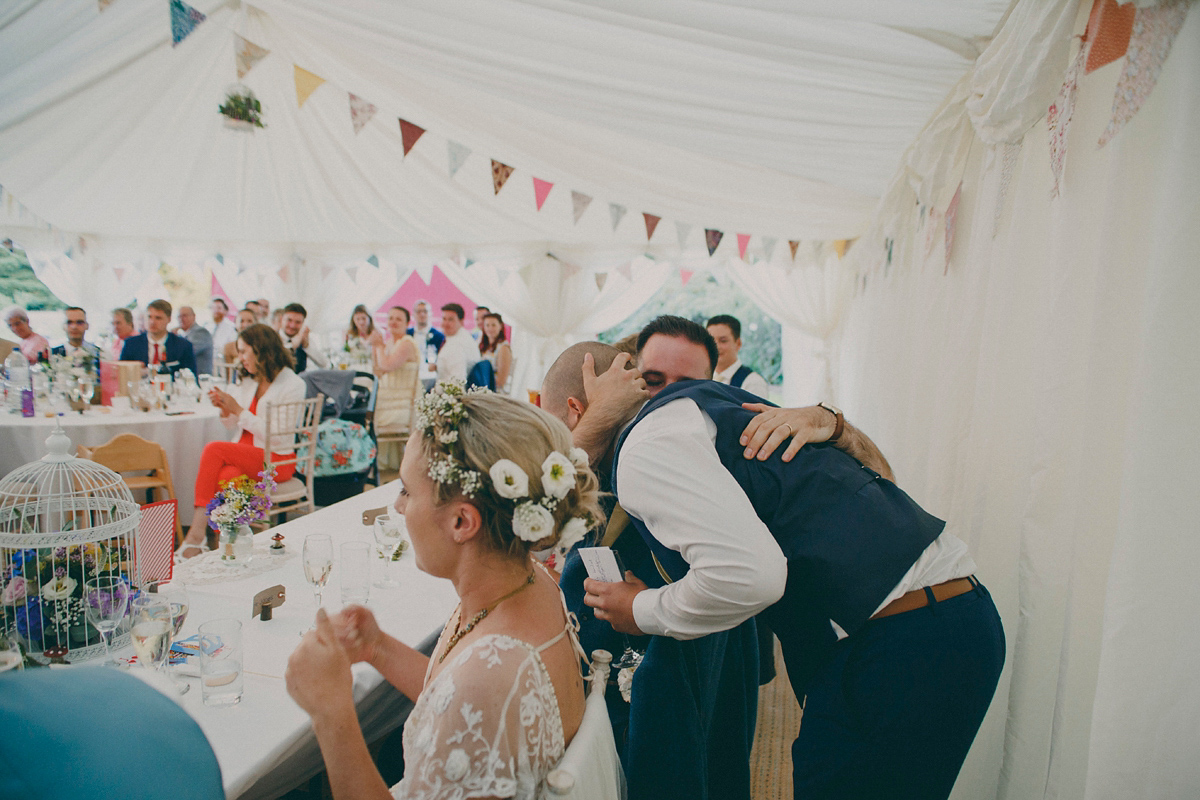 Katie wore a Catherne Deane gown from Leonie Claire bridal boutique in Hove, for her lovely summer garden wedding. Photography by Manon Pauffin.