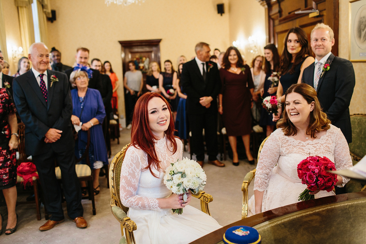 Kate and Lauren married in Catherine Deane and Candy Anthony gowns at Chelsea Town Hall in the Autumn. Photography by Cluadia Rose Carter.