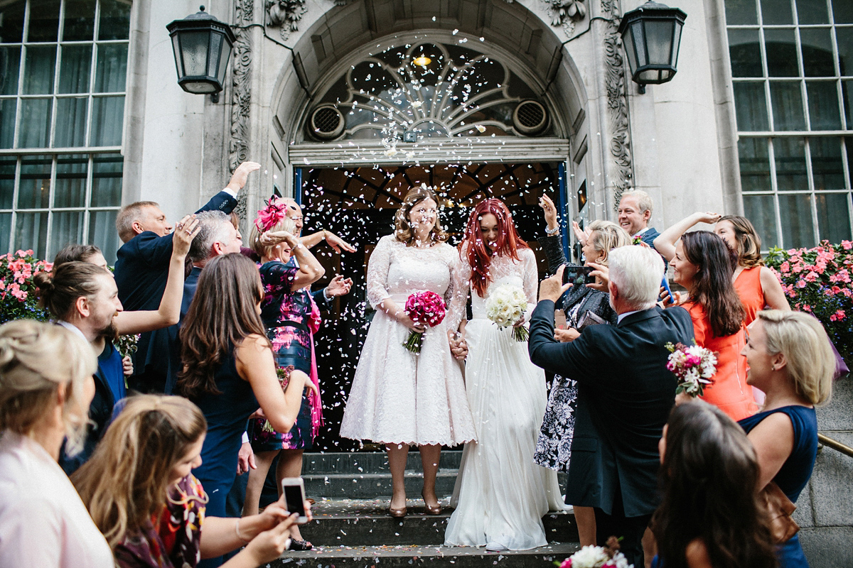 Kate and Lauren married in Catherine Deane and Candy Anthony gowns at Chelsea Town Hall in the Autumn. Photography by Cluadia Rose Carter.