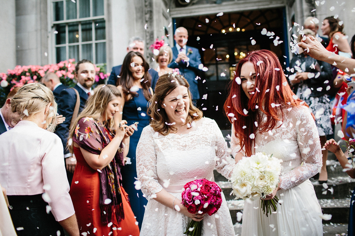 Kate and Lauren married in Catherine Deane and Candy Anthony gowns at Chelsea Town Hall in the Autumn. Photography by Cluadia Rose Carter.