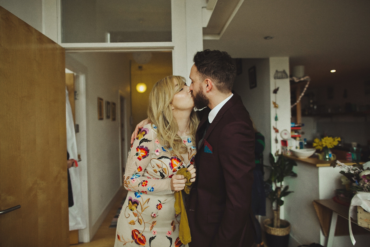 Gillian wore a colourful embroidered long sleeved gown by Temperley for her modern and alternative Woodside Warehouse wedding in Glasgow. Photography by Dan O'Day.