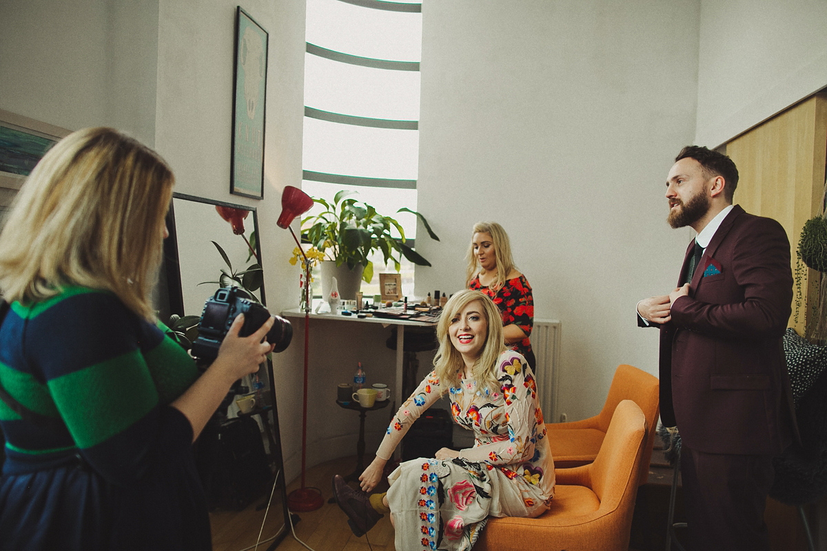 Gillian wore a colourful embroidered long sleeved gown by Temperley for her modern and alternative Woodside Warehouse wedding in Glasgow. Photography by Dan O'Day.