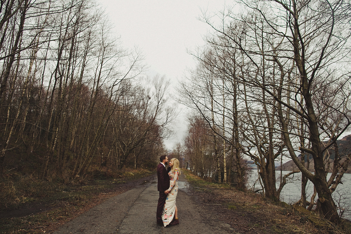 Gillian wore a colourful embroidered long sleeved gown by Temperley for her modern and alternative Woodside Warehouse wedding in Glasgow. Photography by Dan O'Day.