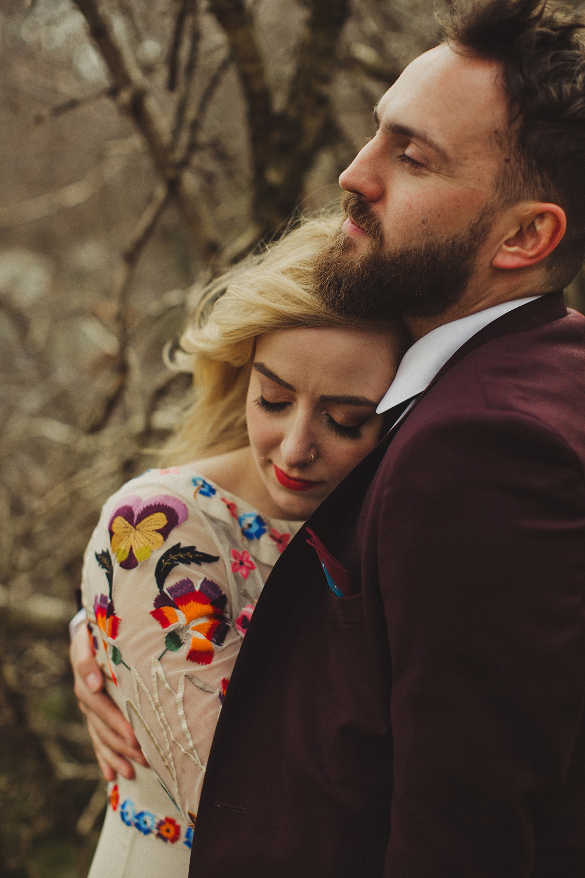 Gillian wore a colourful embroidered long sleeved gown by Temperley for her modern and alternative Woodside Warehouse wedding in Glasgow. Photography by Dan O'Day.