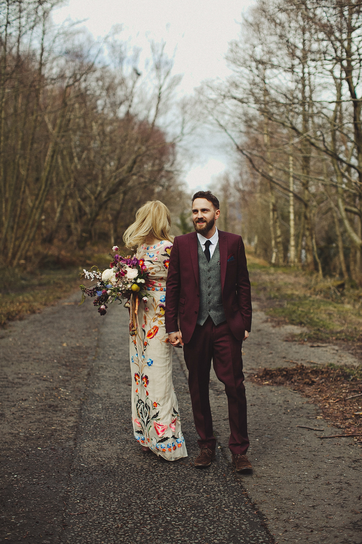 Gillian wore a colourful embroidered long sleeved gown by Temperley for her modern and alternative Woodside Warehouse wedding in Glasgow. Photography by Dan O'Day.