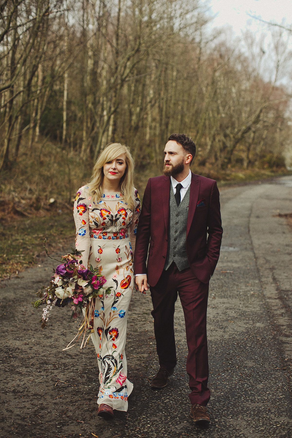 Gillian wore a colourful embroidered long sleeved gown by Temperley for her modern and alternative Woodside Warehouse wedding in Glasgow. Photography by Dan O'Day.