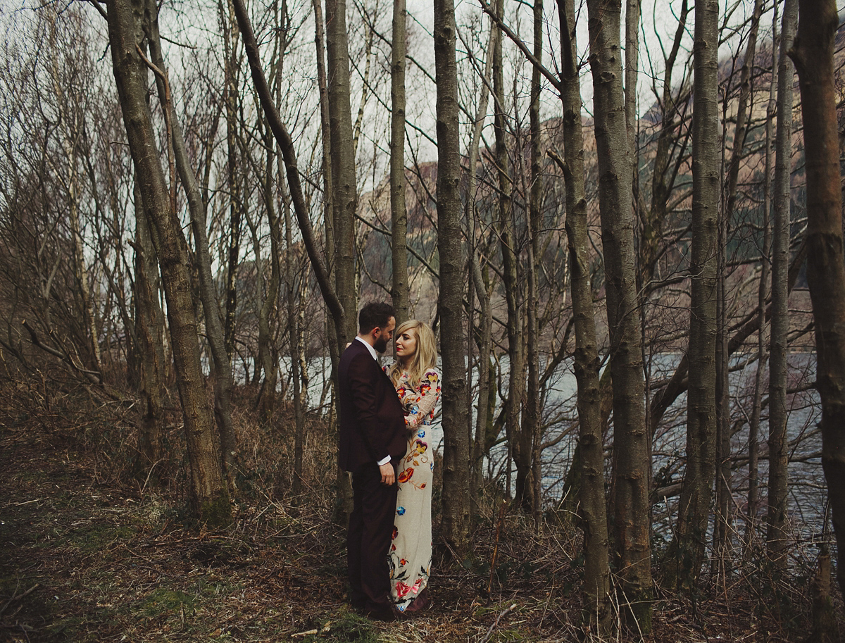 Gillian wore a colourful embroidered long sleeved gown by Temperley for her modern and alternative Woodside Warehouse wedding in Glasgow. Photography by Dan O'Day.